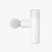 Opove M3 Mini - A white handheld massage gun with a round gray foam head. 